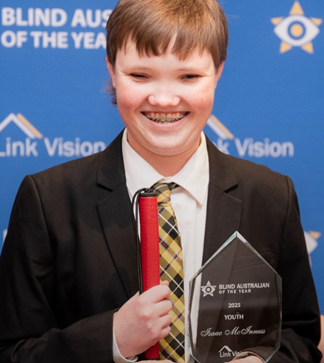 Photo of Isaac McInness holding his trophy for being awarded the 'Blind Australian of the Year - Youth Award